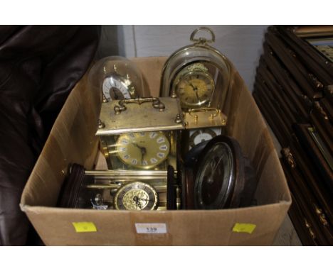 A box of vintage clocks to include perpetual motion clocks, Metamec mantle clock, and Quartz Timemaster carriage clock