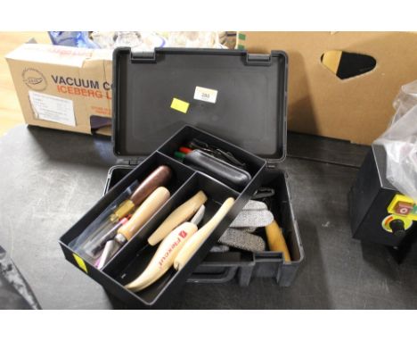 A box of Flex Cut and other carving tools 