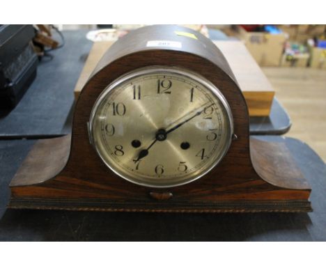 An oak cased mantle clock 