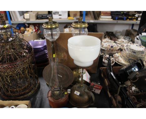 A group lot of vintage brass and metal oil lamp and Tilley lamps