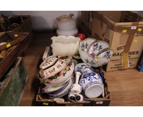 A box of decorative items to include ornamental fruit, light shades, tiles and other items