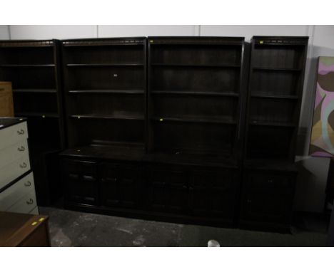 Large dark ercol 4 section room unit, with open tiers to top and cupboards to base