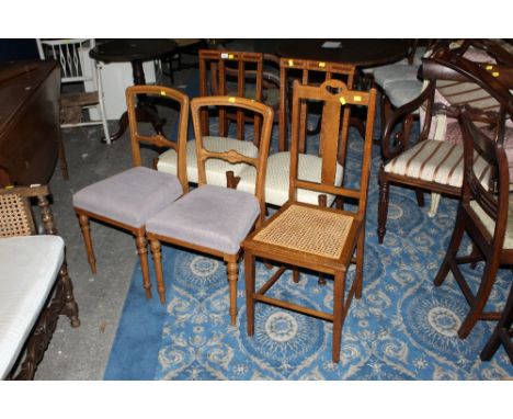 A group of 5 miscellaneous chairs, to include a pair of Edwardian spindle back chairs with cream seats and a light oak berger