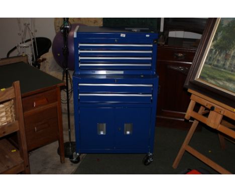 A blue metal workshop cabinet containing mixed tools 