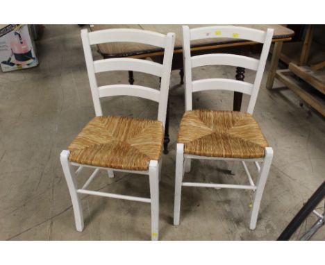 2 white painted and rush seat ladder back chairs