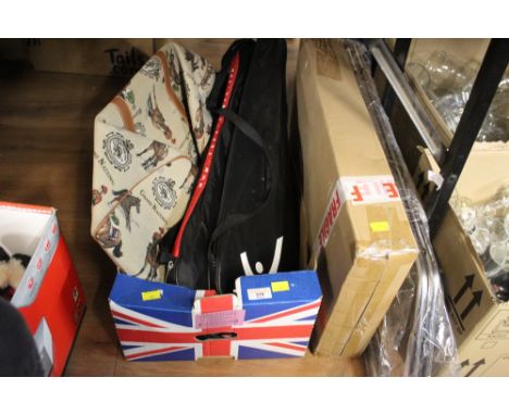 A box of tennis rackets, a chrome metal towel rail, and miscellaneous floor lamp base 