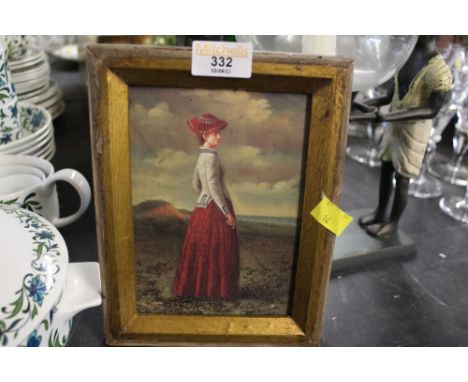 A gilt framed print of a lady playing golf 