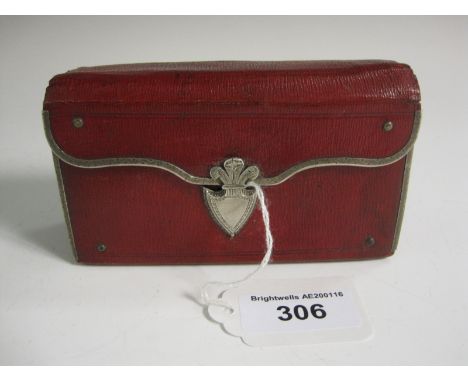 A 19th Century red Travelling Sewing and Writing Case with white metal mounts, shield cartouche, containing scissors, spatula