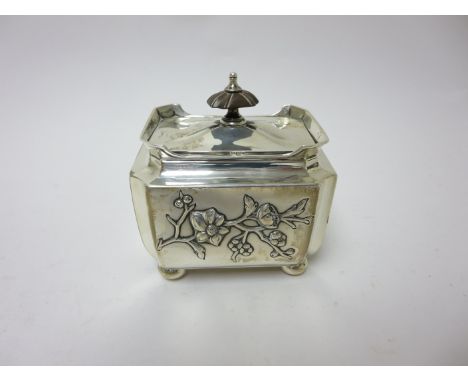 An Edward VII silver Tea Caddy embossed japanesque flowering shrubs, Birmingham 1902, maker: Elkington & Co, No 18750