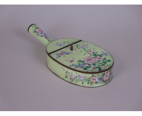 A Chinese enamel lidded Chestnut Roaster decorated butterflies and flowers on green ground, 10in L