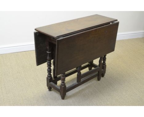 An 18th Century oak gateleg Table with moulded rectangular top on baluster turned supports and silhouette gate legs, 3ft 2in 