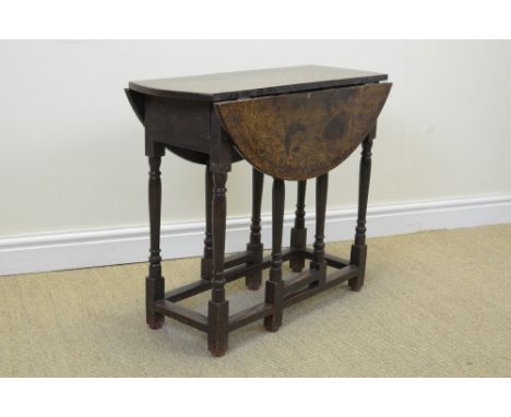 A small antique oak oval Gate-leg Table fitted single drawer on turned and square supports, 2ft 5in