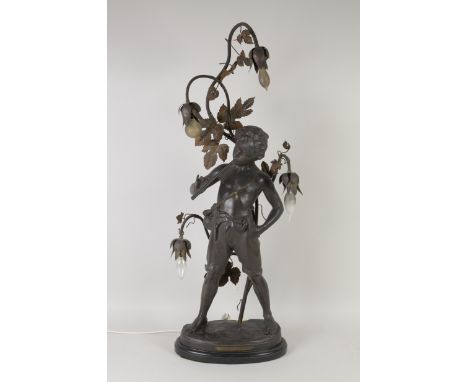 A large Spelter Lamp with Pan supporting four floral branches 'Joueur De Flute' on oval base, 3ft 3in high
