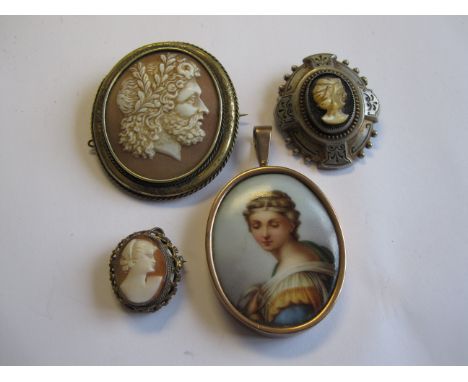 A carved Shell Cameo Brooch of male bust in profile, two Cameo Brooches and a portrait Pendant on porcelain