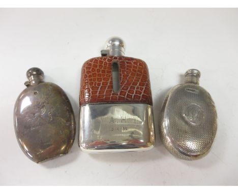 A small Victorian silver Spirit Flask engraved crest, Sheffield 1896, another Spirit Flask with engine turning and initials, 