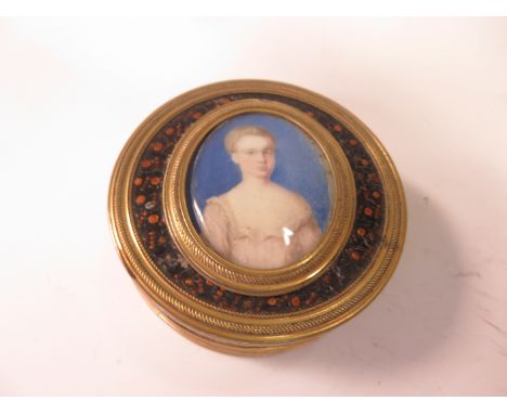 A 19th Century French tortoiseshell circular Box with gilt-metal mounts inset oval half length portrait of young woman, 2 1/2
