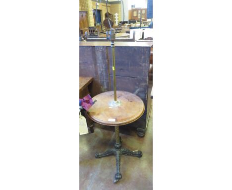 A Victorian mahogany brass and cast iron Standard Lamp/Table on spiral column and quadruple splay base and casters