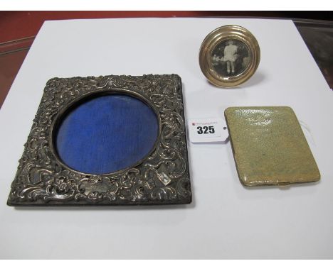 A Hallmarked Silver Mounted Photograph Frame, (damages); together with a small circular photograph frame, on easel back and a