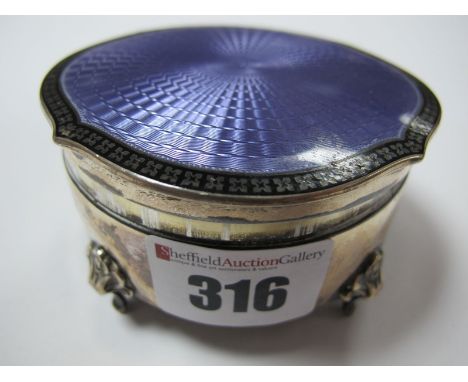 Circular Silver Dressing Table Trinket Box, on four feet, having purple enamel inset to shaped lid, Birmingham 1926. 