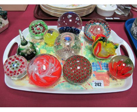 Eleven Studio Glass Paperweights, including Millefiori, a blue cushion and bubble inclusions example a chick and flower inclu
