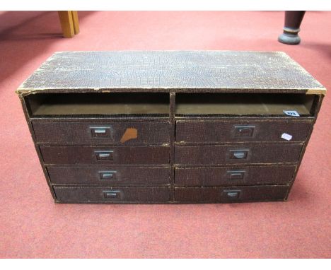A Circa 1930's Eight Drawer Office Filing Cabinet, with reptile skin effect covering stamped east-light to handles, 33cm high