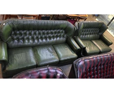 Two green leather button back sofas