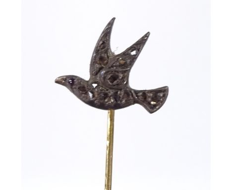 A figural diamond set bird stickpin, pave set with rose-cut diamonds and cabochon ruby eye, length 62mm, 1.8g 