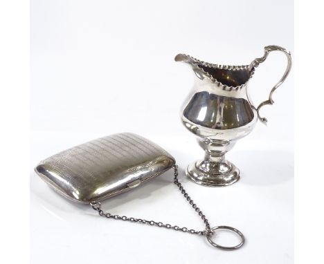 A silver-mounted evening purse by Boots Pure Drug Company, hallmarks Birmingham 1918, length 10cm, together with an Edwardian