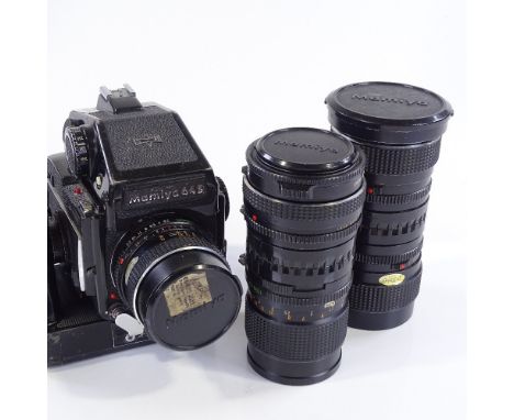 A Mamiya 645 1000s medium format film camera, with power winder grip and 5 lenses 