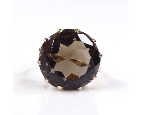 A 9ct gold smoky quartz dress ring, setting height 16mm, size K, 5.3g 