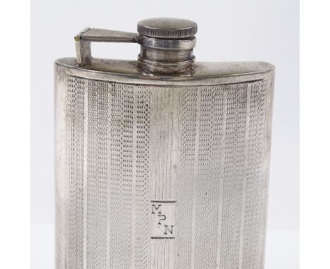 A sterling silver curved hip flask, with engine turned decoration, height 12.5cm, 5oz 