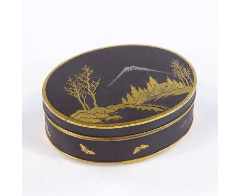 A Japanese Komai gilt-metal and enamel oval box, with landscape scene to the lid, signed under base, length 6.5cm 