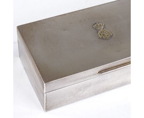 An Asprey &amp; Co Ltd rectangular silver cigarette box, presented by the Officers 11th Hussars, with engine turned decoratio