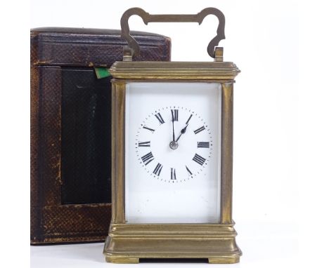 A French brass-cased carriage clock, early 20th century, 8-day movement, case height 12cm, in leather travelling case 