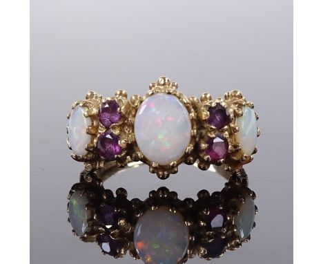 A 9ct gold 7-stone opal and ruby half-hoop ring, engraved shoulders, setting height 11.6mm, size O, 4.1g 