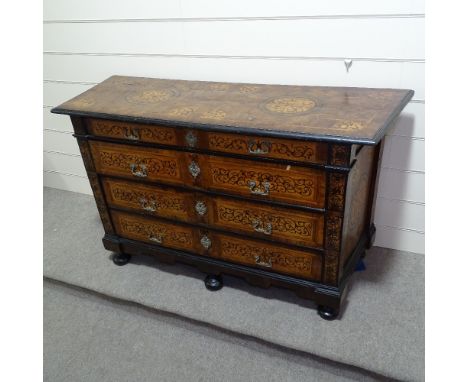An Italian 18th century walnut 4-drawer commode, all over marquetry and parquetry inlaid decoration, with original cast-brass
