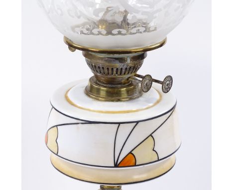An Art Deco Duplex brass oil lamp, with stylised painted opaque glass font and etched glass shade, height to top of shade 49c