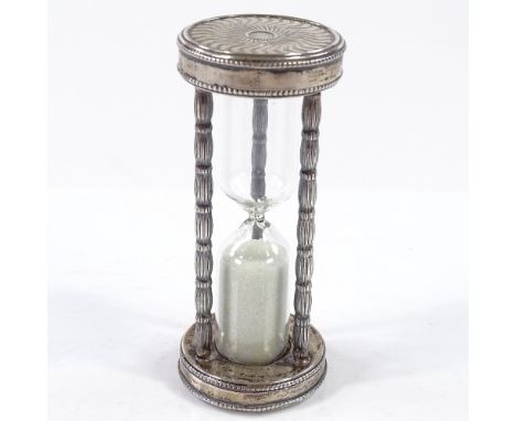 An Italian silver-mounted hour glass egg timer, with geometric terminals and beaded edge, length 8.5cm 