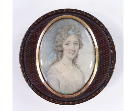 A Georgian circular lacquer snuffbox, with inset miniature watercolour on ivory, portrait of a young woman, in unmarked gold 