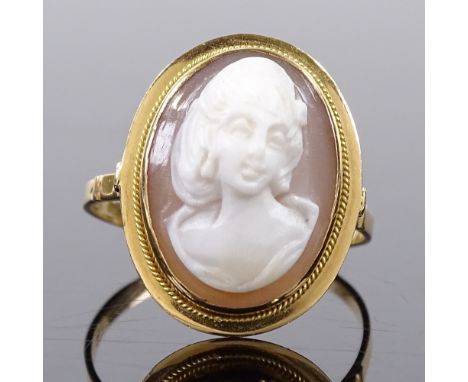 An 18ct gold relief carved cameo panel ring, depicting female portrait, panel height 16mm, size P, 3.3g 