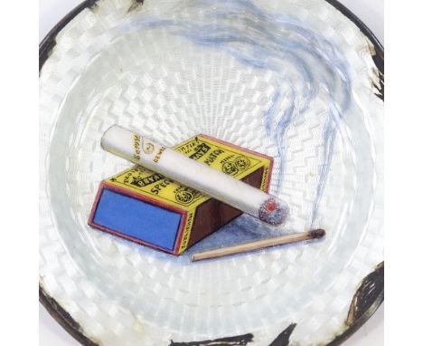 A sterling silver and enamel ashtray, with cigarette and matchbox design, diameter 8.5cm, 1.7oz (some enamel A/F) 