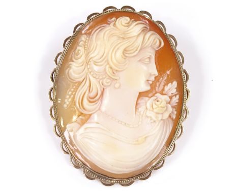 An oval relief carved cameo panel brooch, depicting female portrait, in 9ct gold frame, panel height 45.1mm, 14.5g 