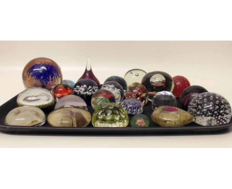 Twenty six modern coloured glass paperweights one by Caithness. Condition report: see terms and conditions