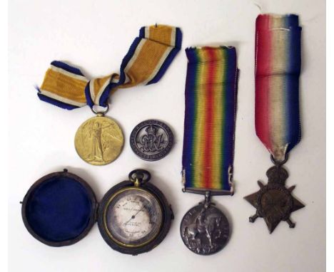 Three WWI service medals, a cap badge and pocket barometer. Condition report: see terms and conditions