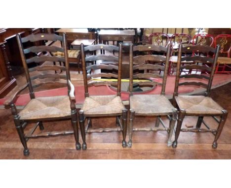 Four reproduction Lancashire style dining chairs with ladder-backs and rush seats (1 carver). Condition report: see terms and