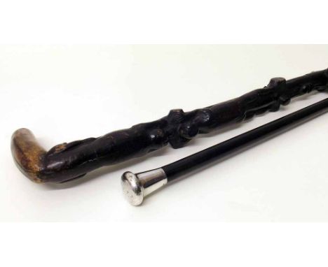 Black lacquered walking cane with silver handle and native carved walking stick. Condition report: see terms and conditions