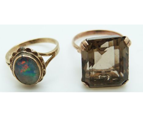 A 9ct gold ring set with a large emerald cut smoky quartz and a 9ct gold ring set with an opal triplet, size M, 6.6g, N, 3.5g