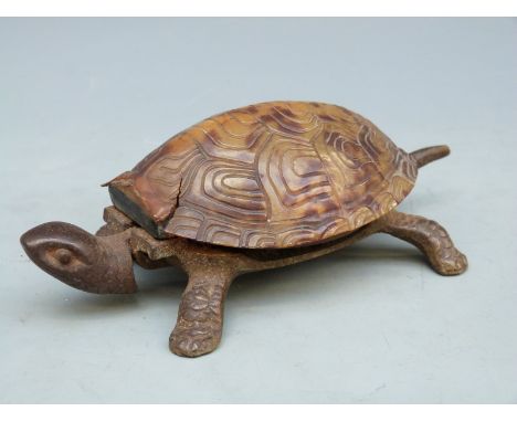 A vintage clockwork tortoise desk bell operated by pressing the head or tail, impressed GSS to base, length 14cm