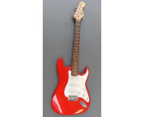 Stratocaster Squier Fender Strat electric guitar in red lacquered finish  no. CA003076310 with Stagg soft case  