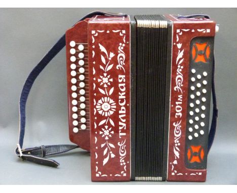 Tulskaya Russian made button accordion, with 25 treble buttons and 25 bass, in lacquered burgundy finish